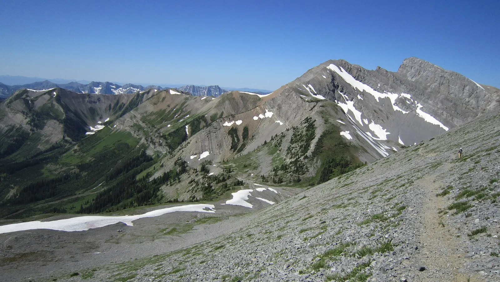 Hiker on a mountain trail above Fernie, British Columbia