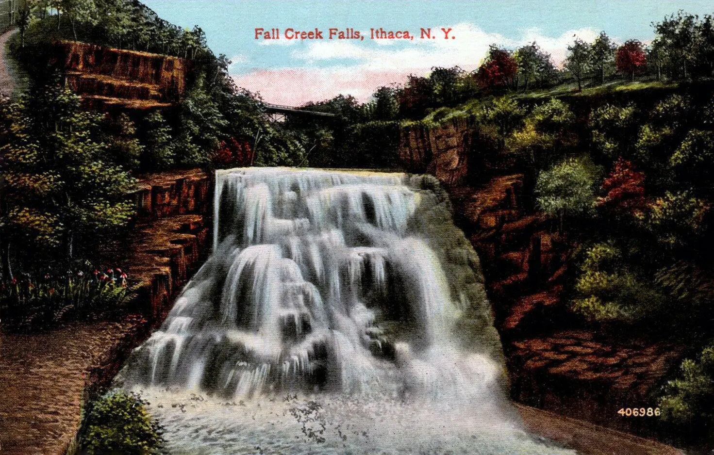 The wide cascade of Ithaca Falls tumbling over stepped rock ledges, Finger Lakes, New York