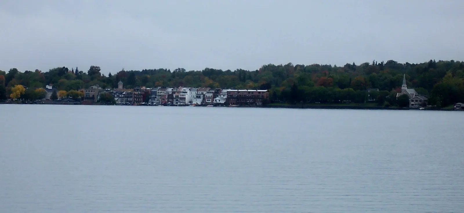 The village waterfront of Skaneateles with boats on clear lake water, Finger Lakes, New York