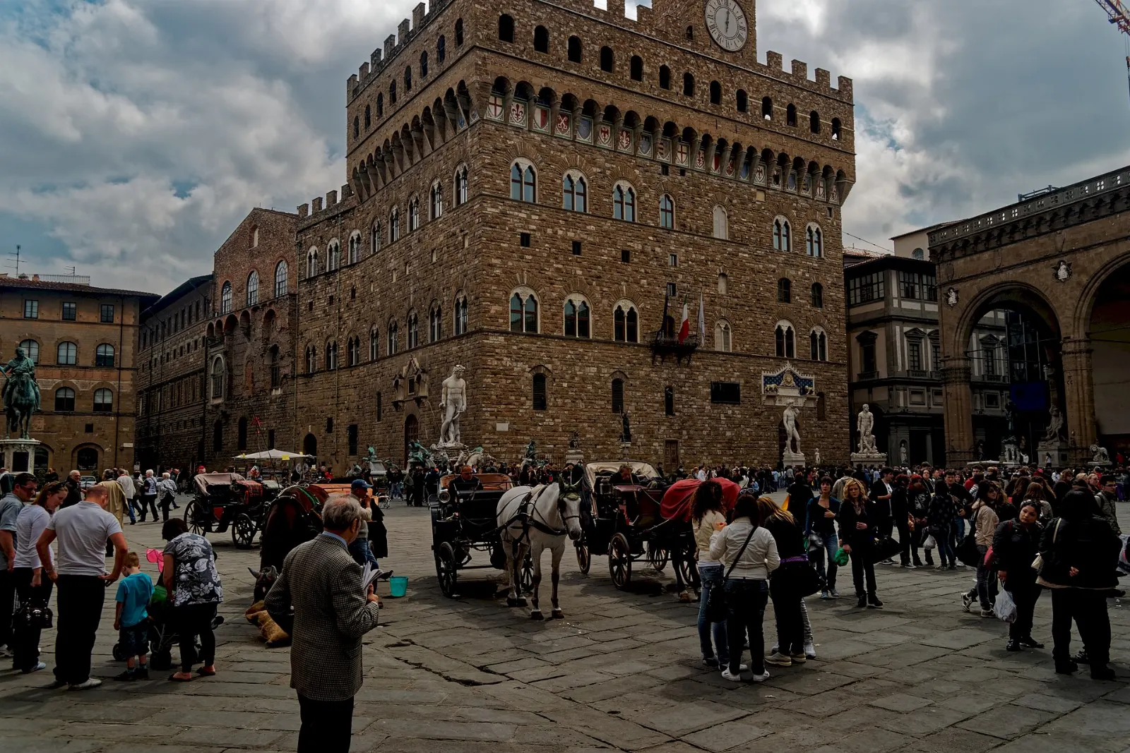 Palazzo Vecchio with its crenellated tower over Piazza della Signoria, Florence, Italy