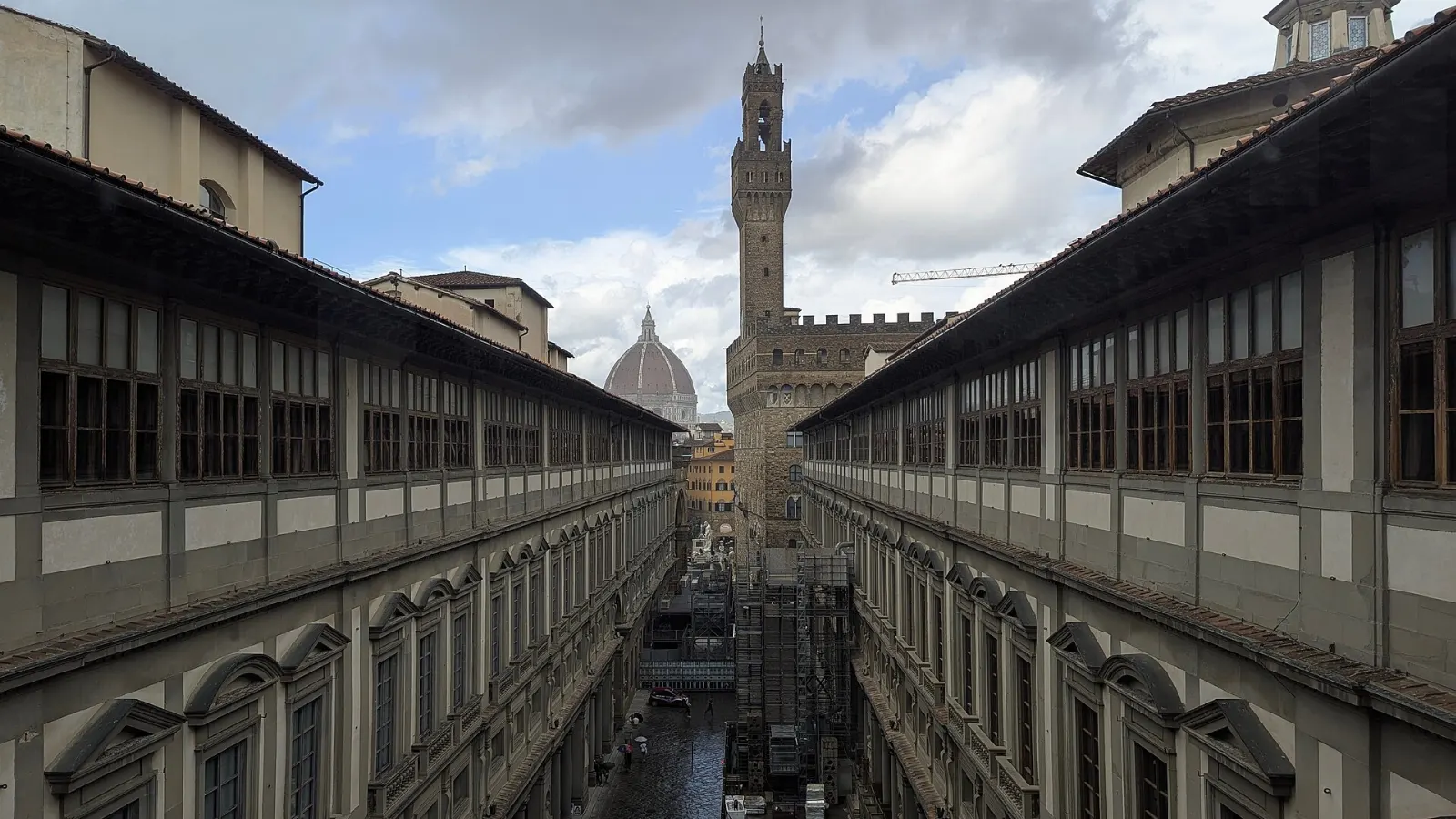 The long colonnaded courtyard of the Uffizi leading toward the Arno, Florence, Italy