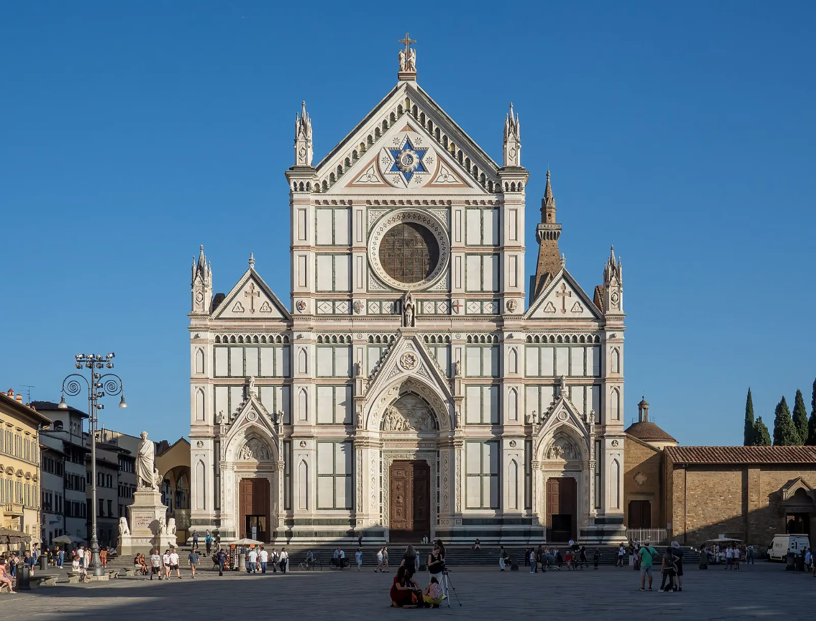 The marble facade of the Basilica of Santa Croce over its large square, Florence, Italy