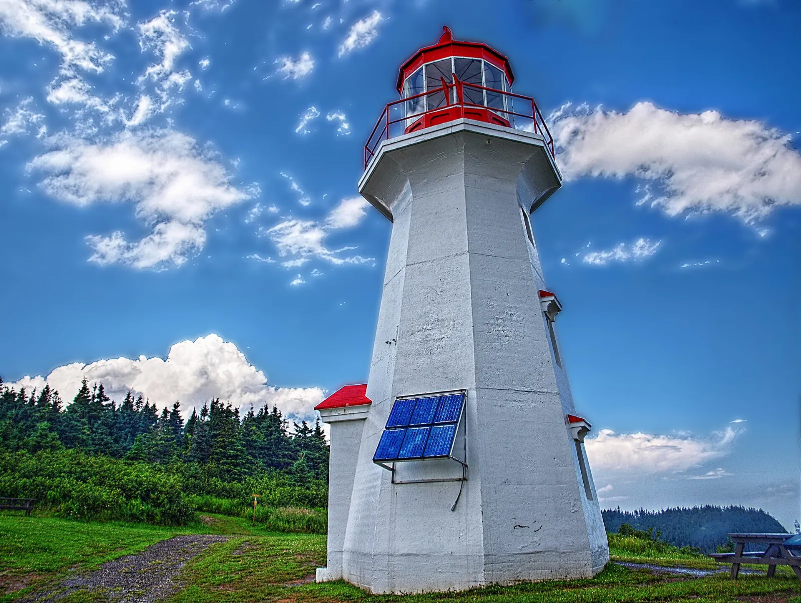 White Cap-Gaspé lighthouse on the cliff edge above the Gulf of St. Lawrence, Forillon National Park, Quebec