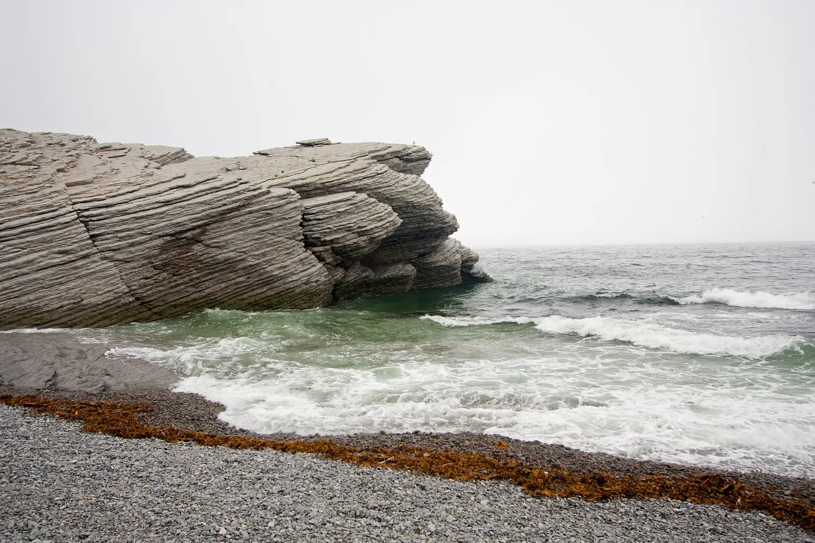 Cliffs and pebble cove at Cap Bon-Ami in Forillon National Park, Quebec