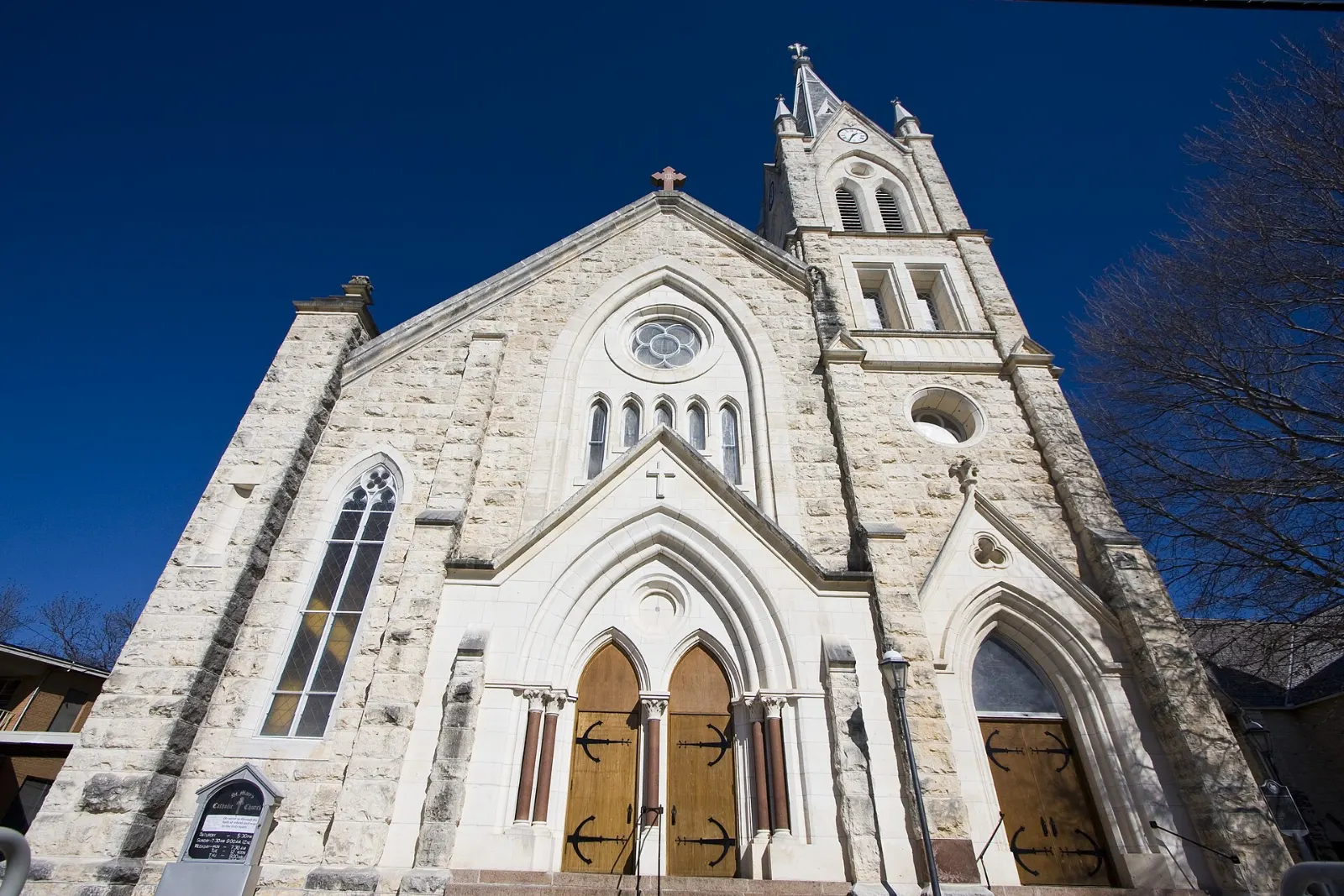 Tall Gothic Revival stone church of St. Mary's next to the older Marienkirche, Fredericksburg, Texas