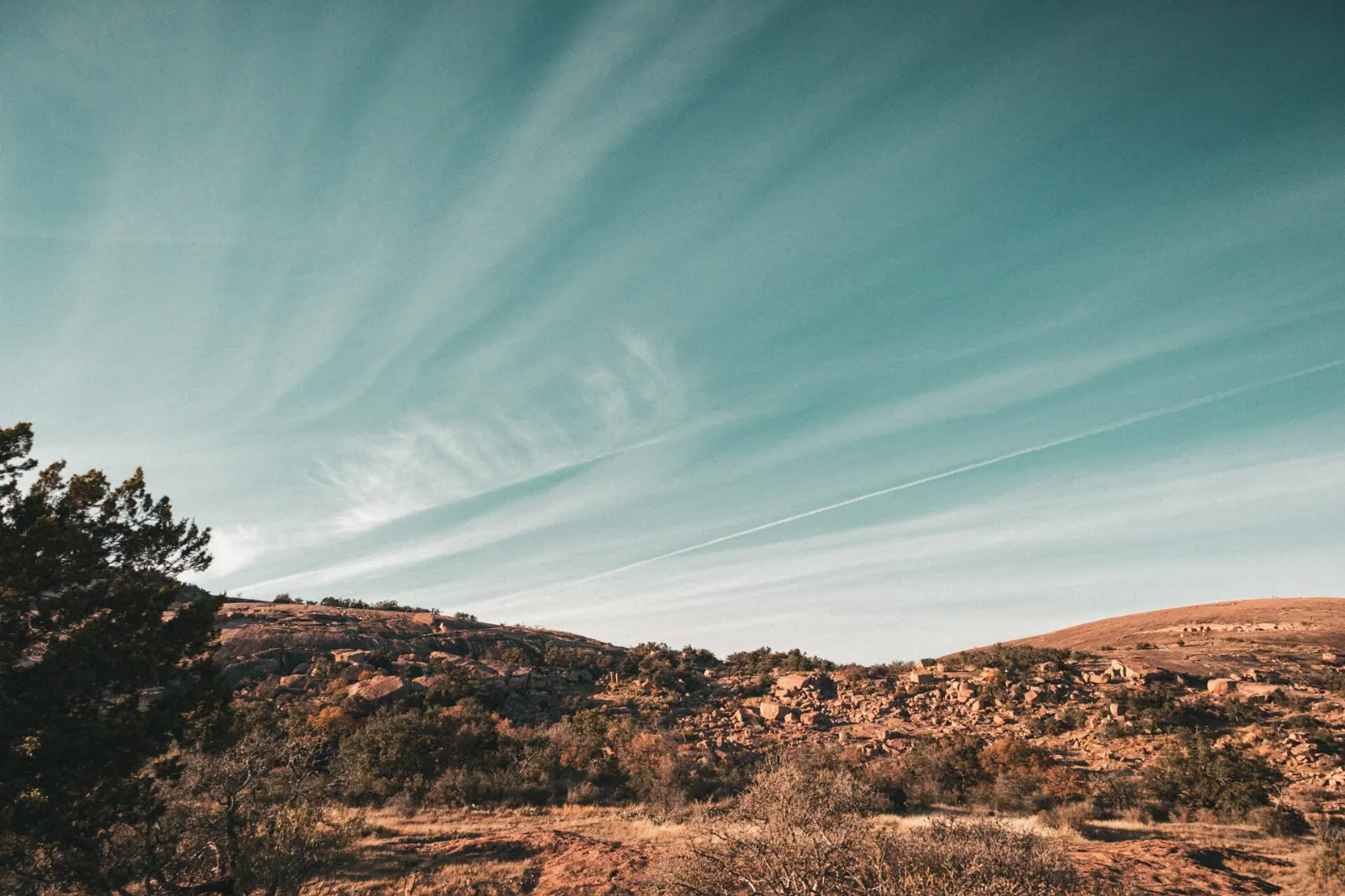 Massive pink granite dome of Enchanted Rock rising above the Hill Country, Fredericksburg, Texas