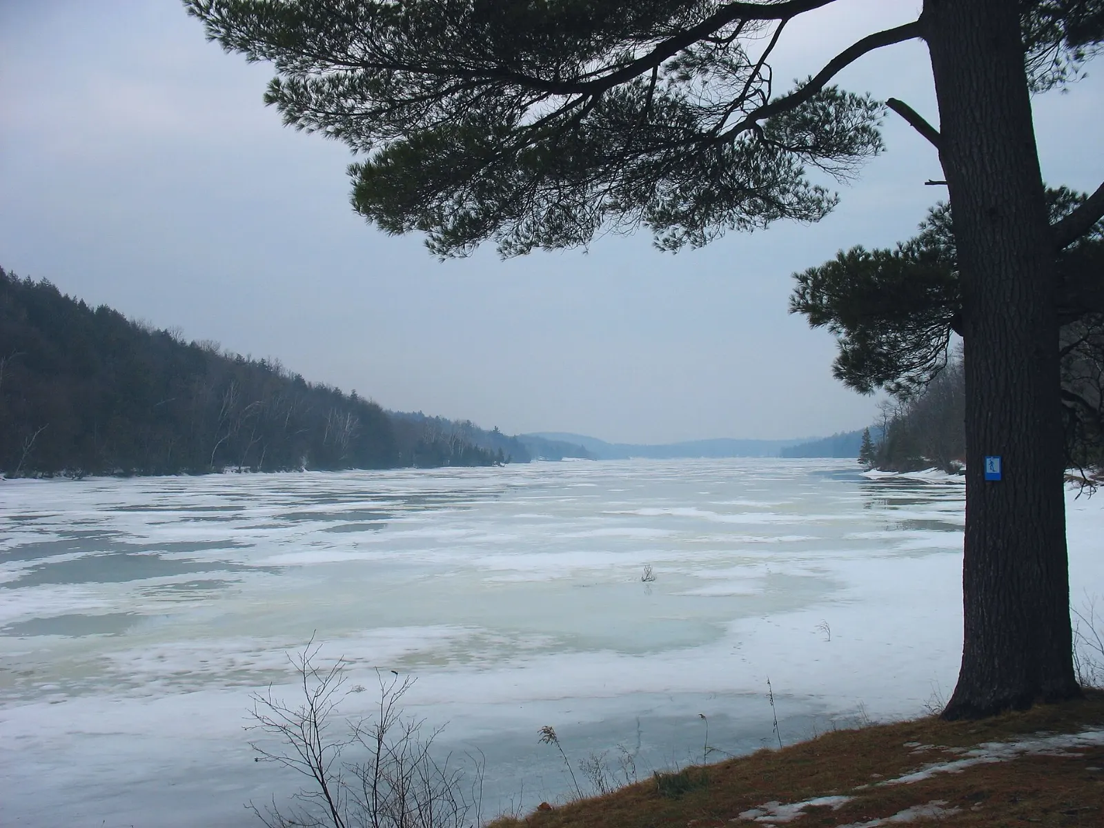 Sandy beach and canoes at Lac Philippe, Gatineau Park, Quebec
