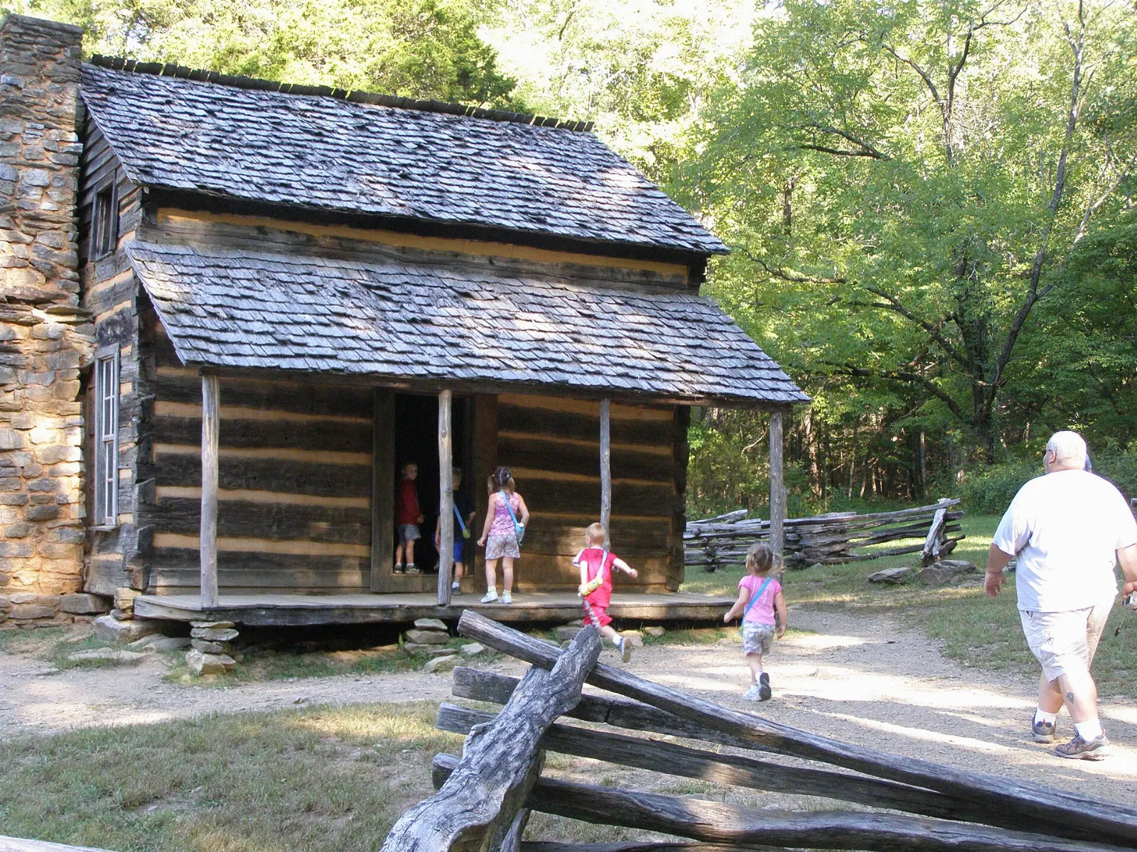 The John Oliver Place log cabin in Cades Cove with mountains behind, Great Smoky Mountains National Park, Tennessee and North Carolina