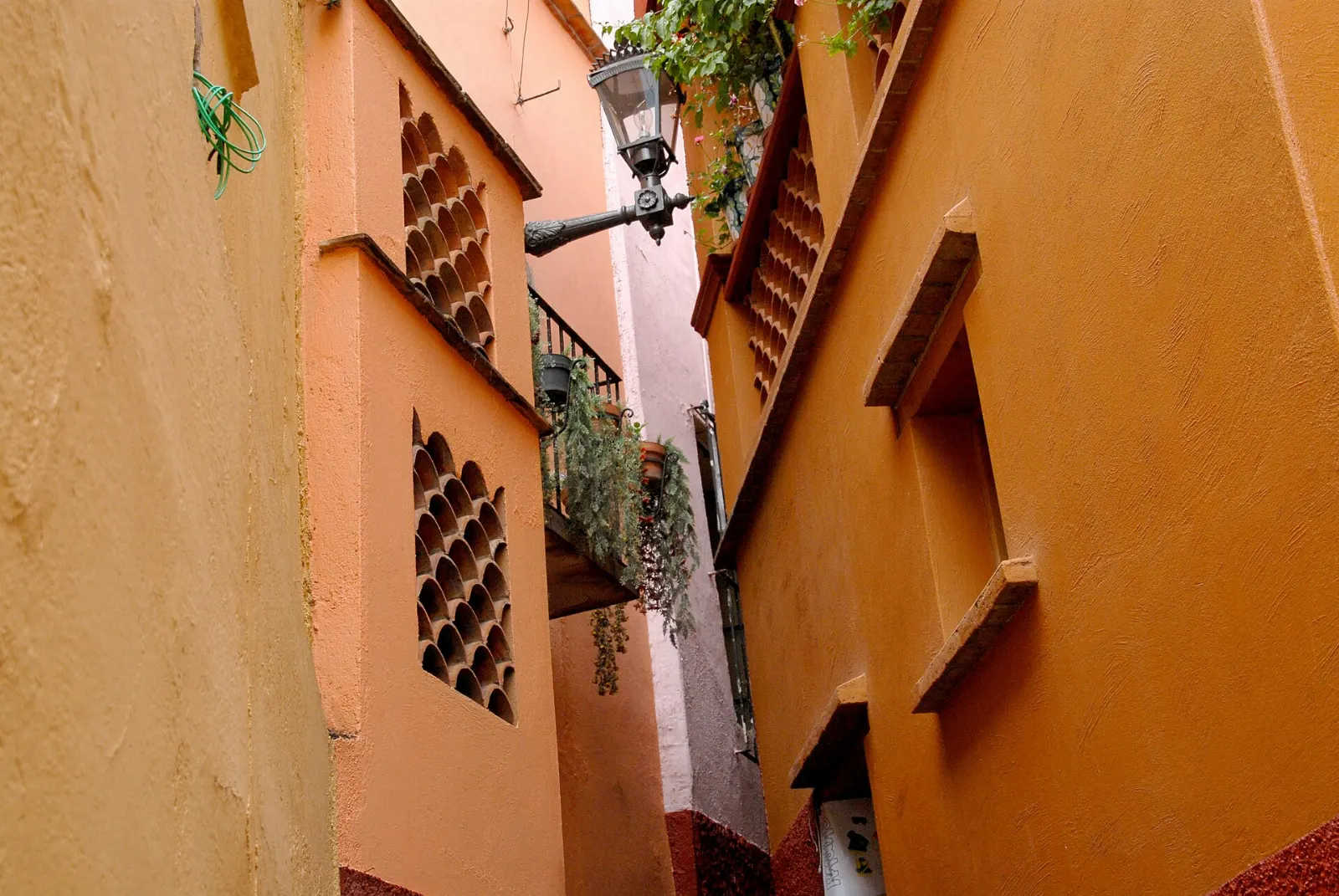 Two balconies almost touching across the narrow Callejón del Beso, Guanajuato City, Guanajuato