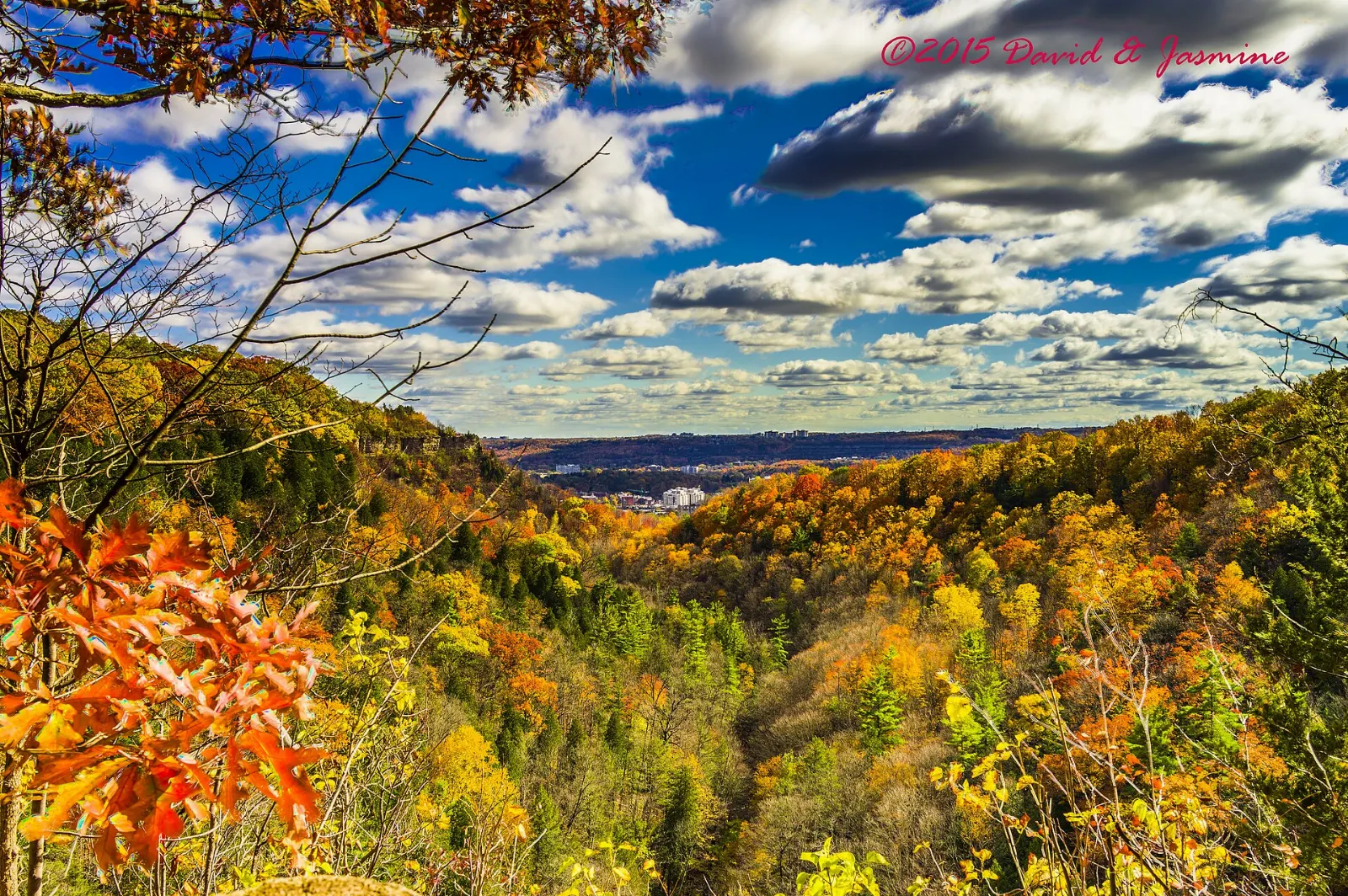 Hikers on the rock lookout at Dundas Peak above the Dundas Valley, Hamilton, Ontario