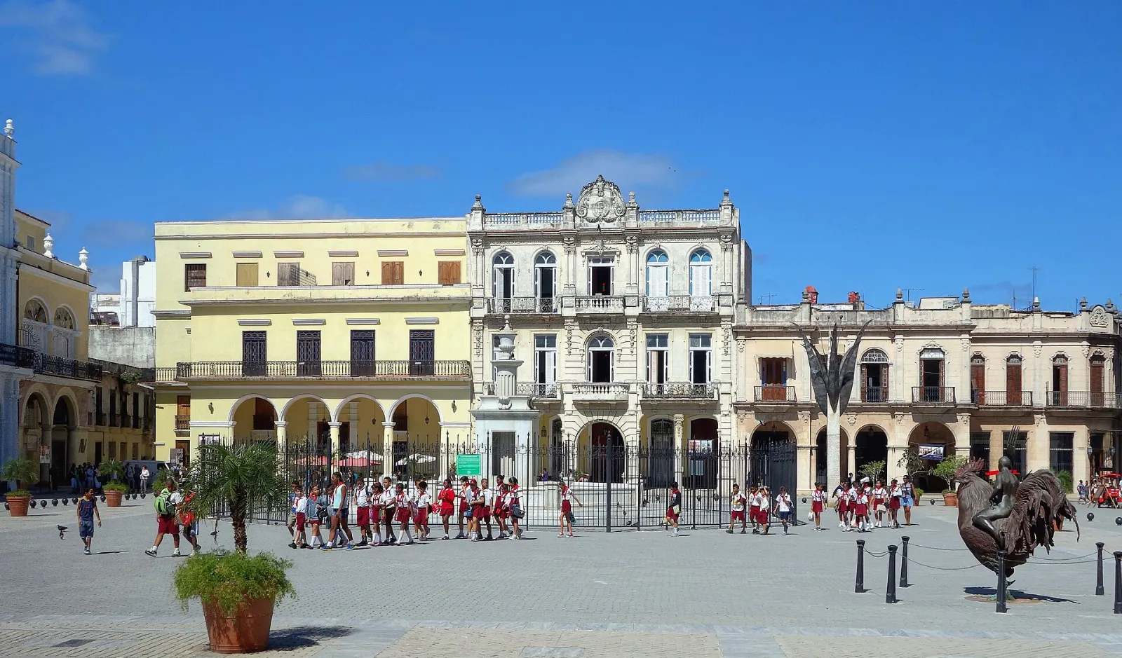 Colorful restored colonial buildings with arcades around Plaza Vieja in Old Havana, Cuba
