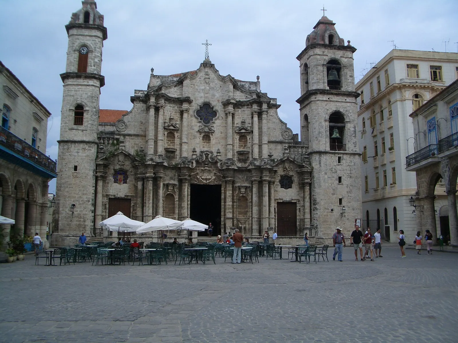 The baroque limestone facade and two uneven towers of Havana Cathedral, Cuba