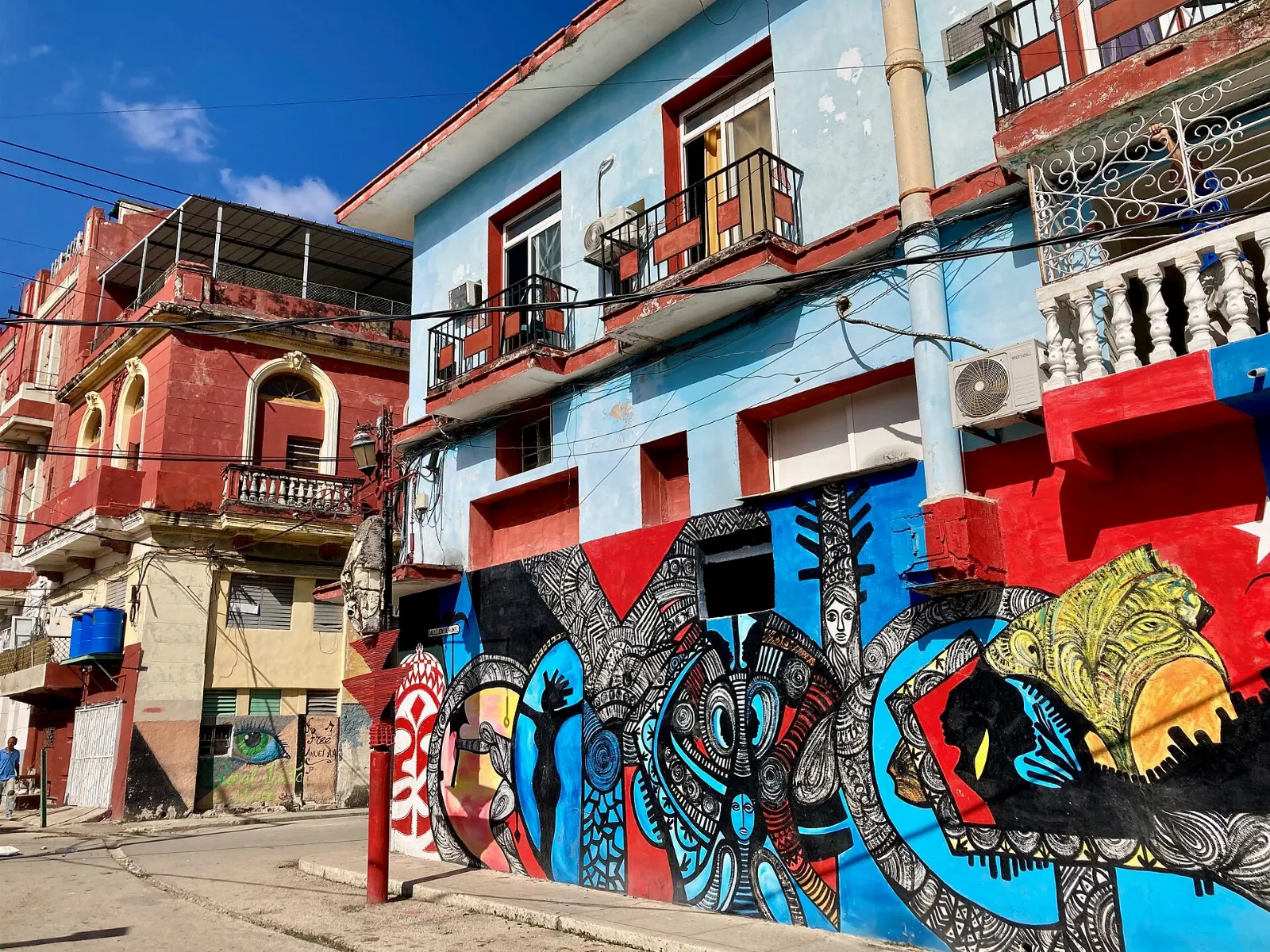 Bright murals and sculptures lining the narrow Callejón de Hamel alley, Havana, Cuba