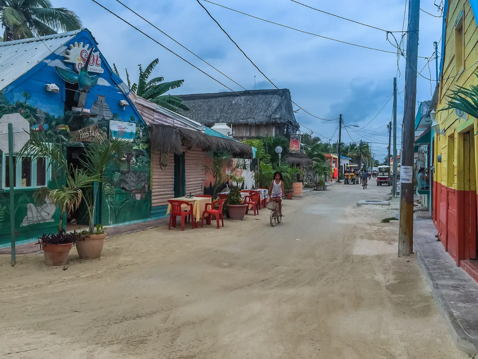 Sandy street and brightly painted buildings in Holbox town, Quintana Roo