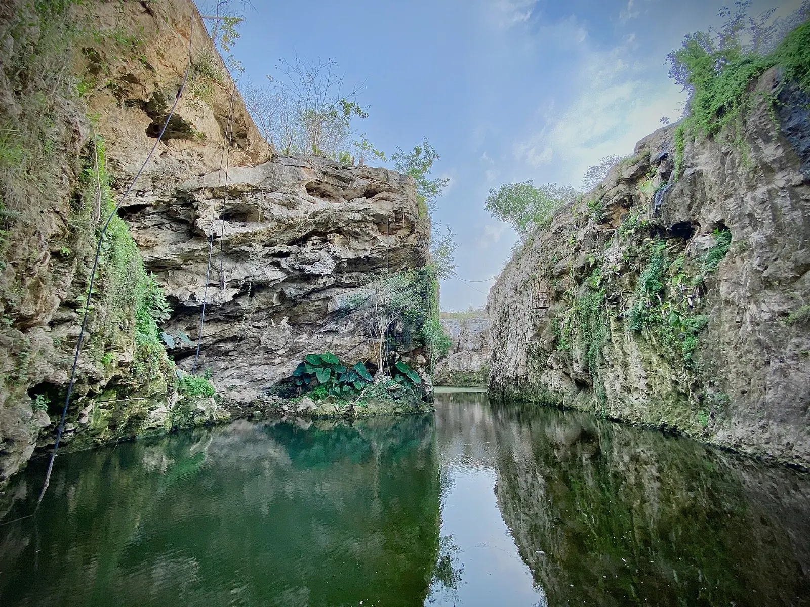 Open cenote with a swimming platform near Homún, Yucatán