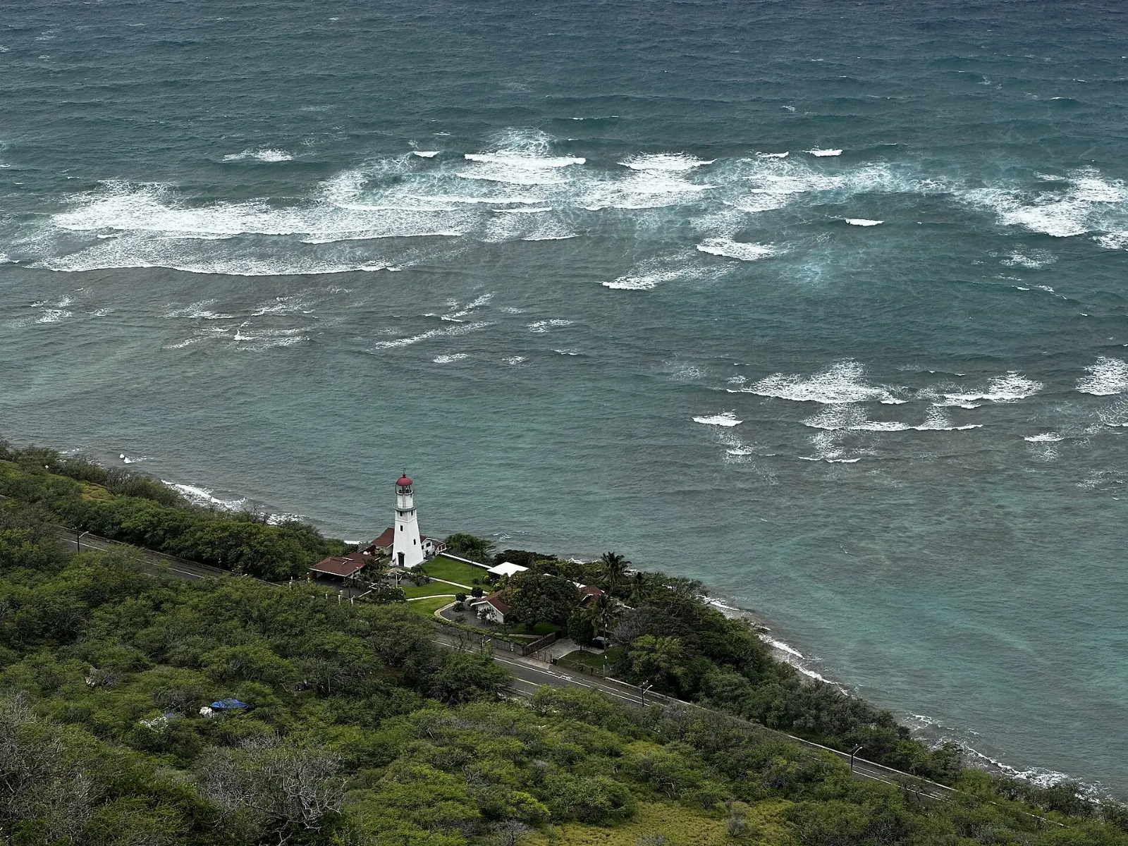 View from the Diamond Head summit over the crater rim toward Waikiki high-rises, Honolulu, Hawaii