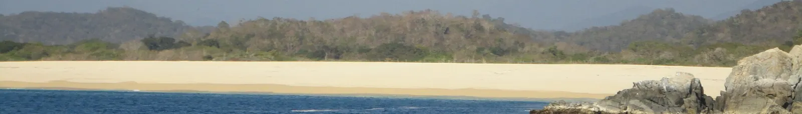 Quiet white sand cove in Huatulco National Park, Oaxaca