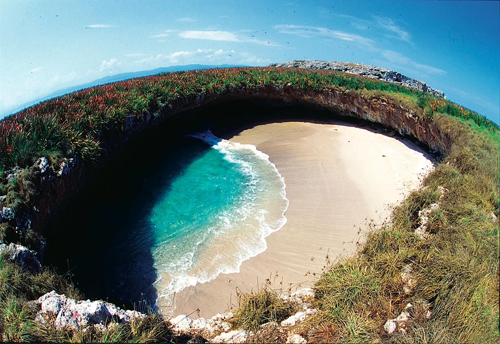 Small sandy beach inside a rocky crater on Islas Marietas, Nayarit
