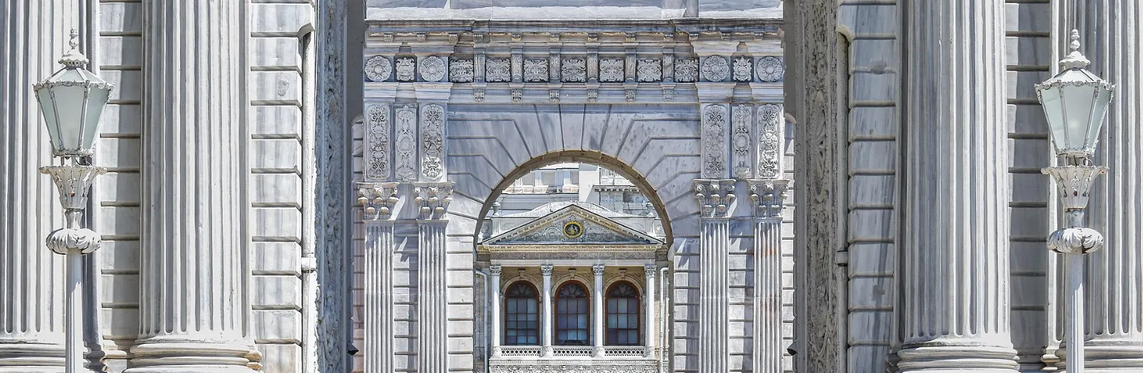The long white marble facade of Dolmabahce Palace on the Bosphorus shore, Istanbul, Türkiye