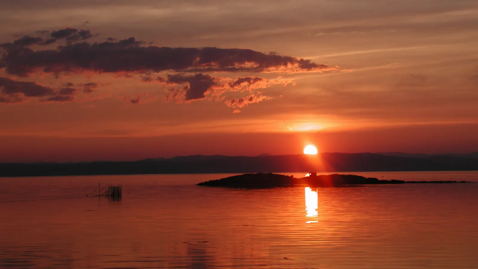 Orange sunset over the St. Lawrence River at Kamouraska, Quebec