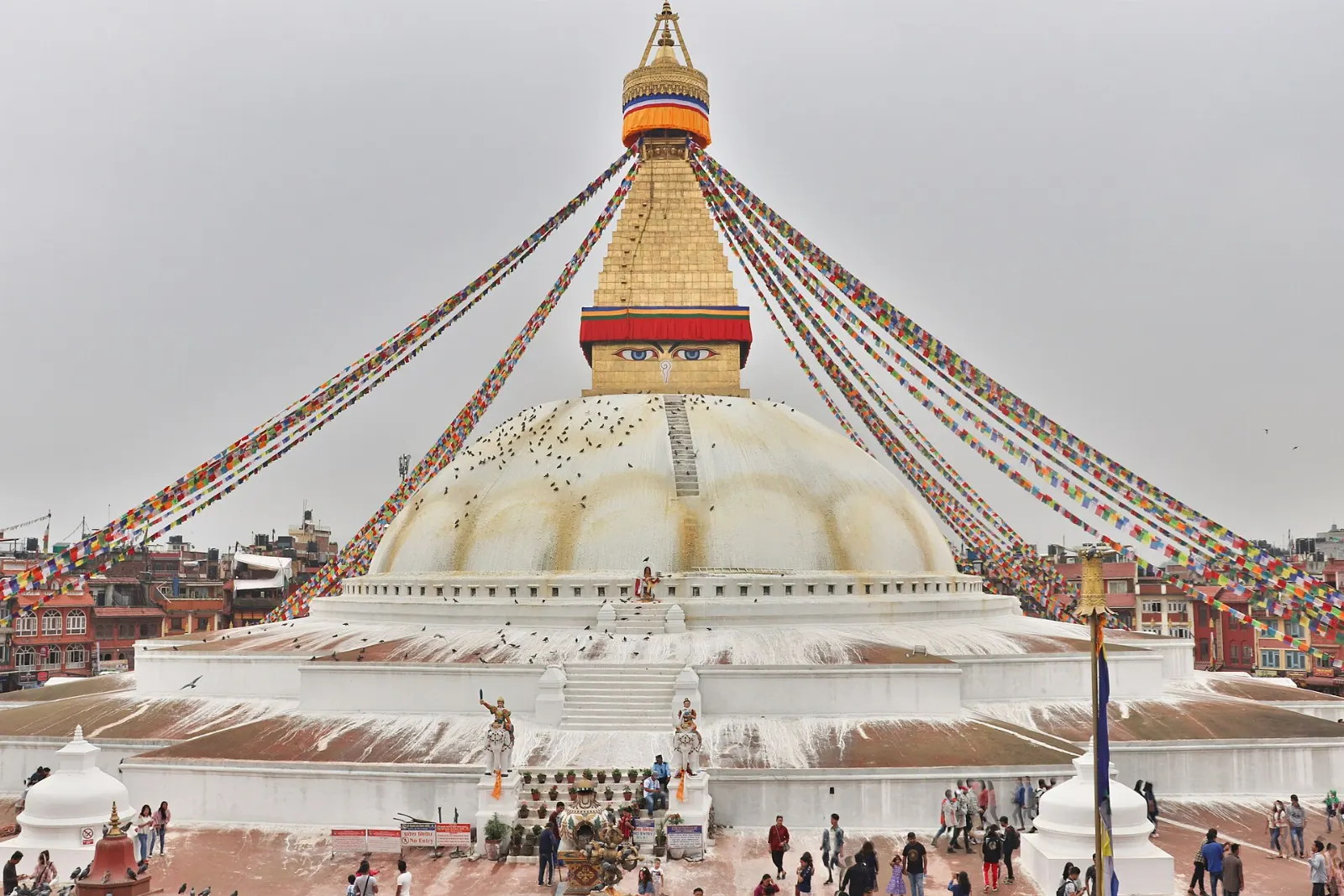 The vast white dome of Boudhanath Stupa with prayer flags, Kathmandu, Nepal