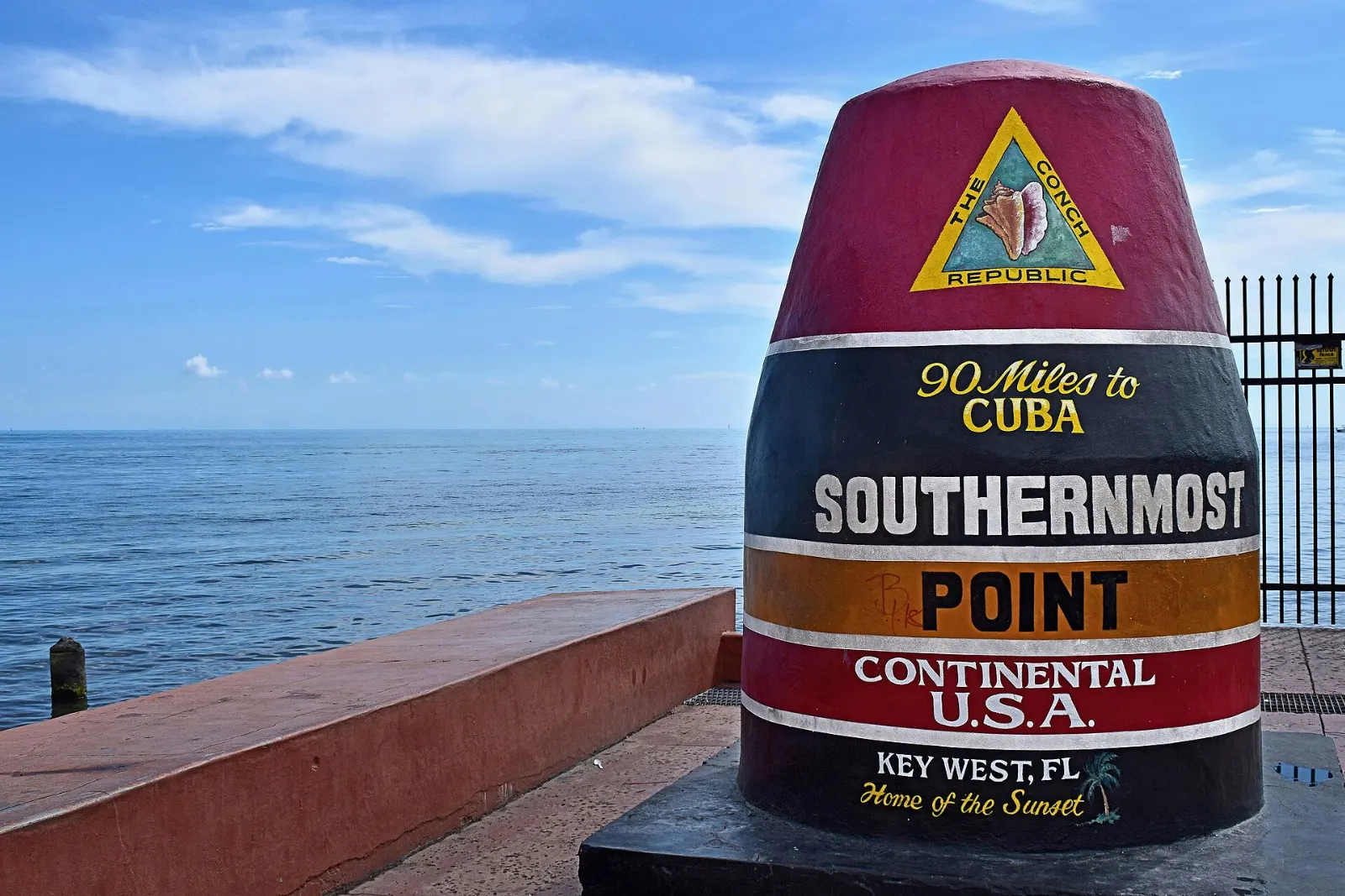 Striped concrete buoy marking the Southernmost Point in Key West, Florida