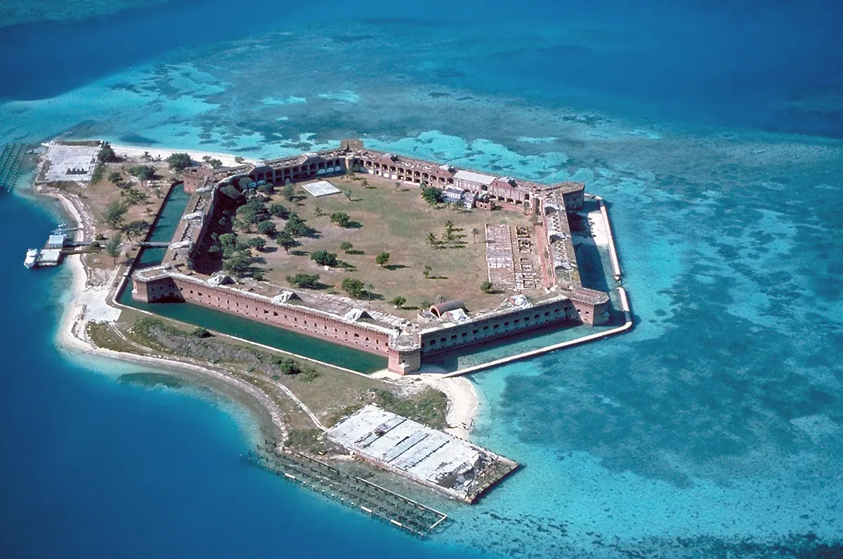 Hexagonal brick walls of Fort Jefferson surrounded by turquoise water on Garden Key, Key West, Florida
