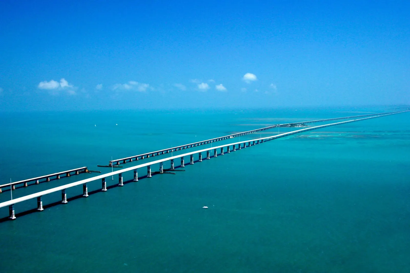 Long span of the Seven Mile Bridge crossing open blue water in the Florida Keys, Key West, Florida