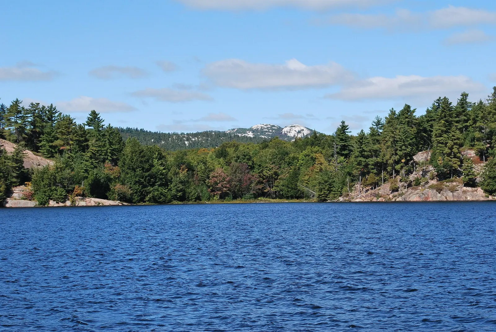 View from the quartzite ridge of Silver Peak over blue lakes, Killarney Provincial Park, Ontario
