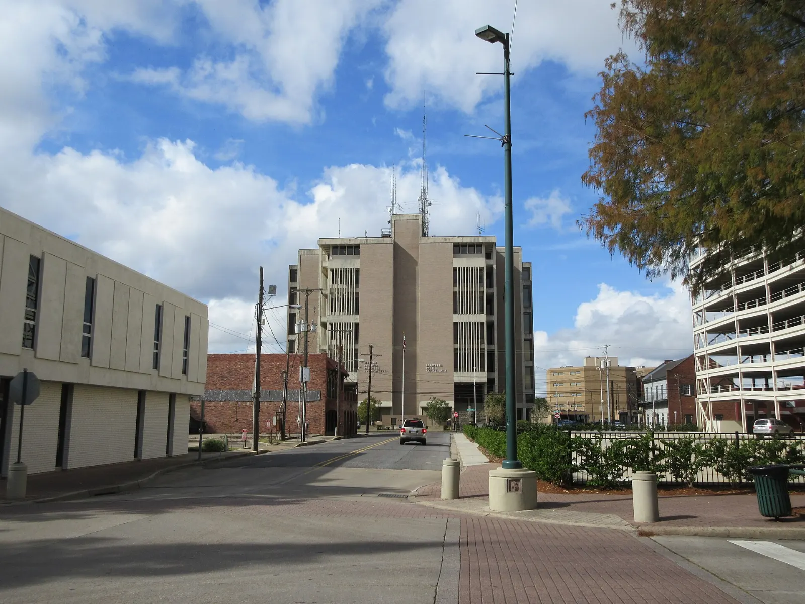 Downtown street lined with low brick buildings and shopfronts, Lafayette, Louisiana
