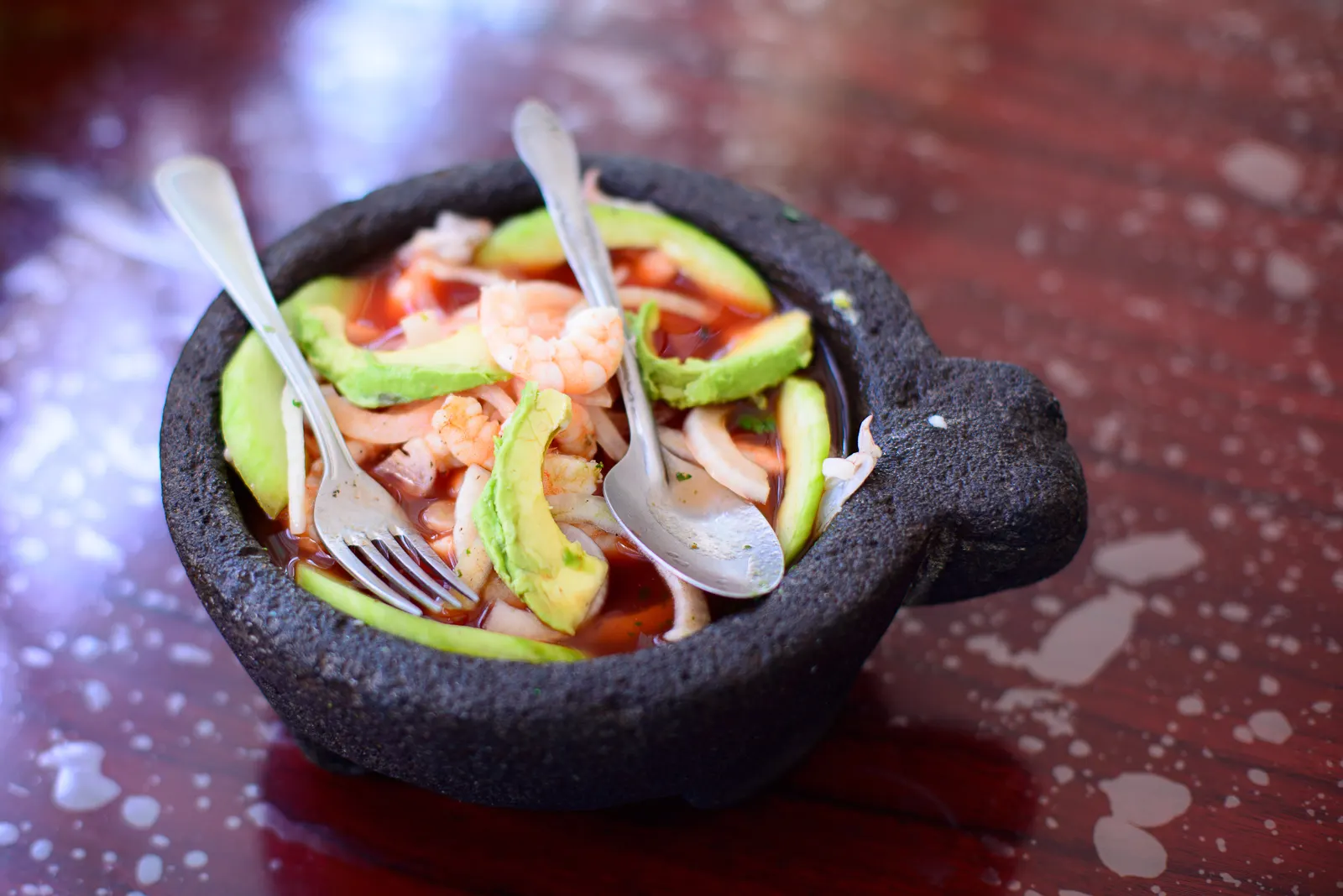Sizzling molcajete bowl filled with seafood, Lake Chapala, Jalisco