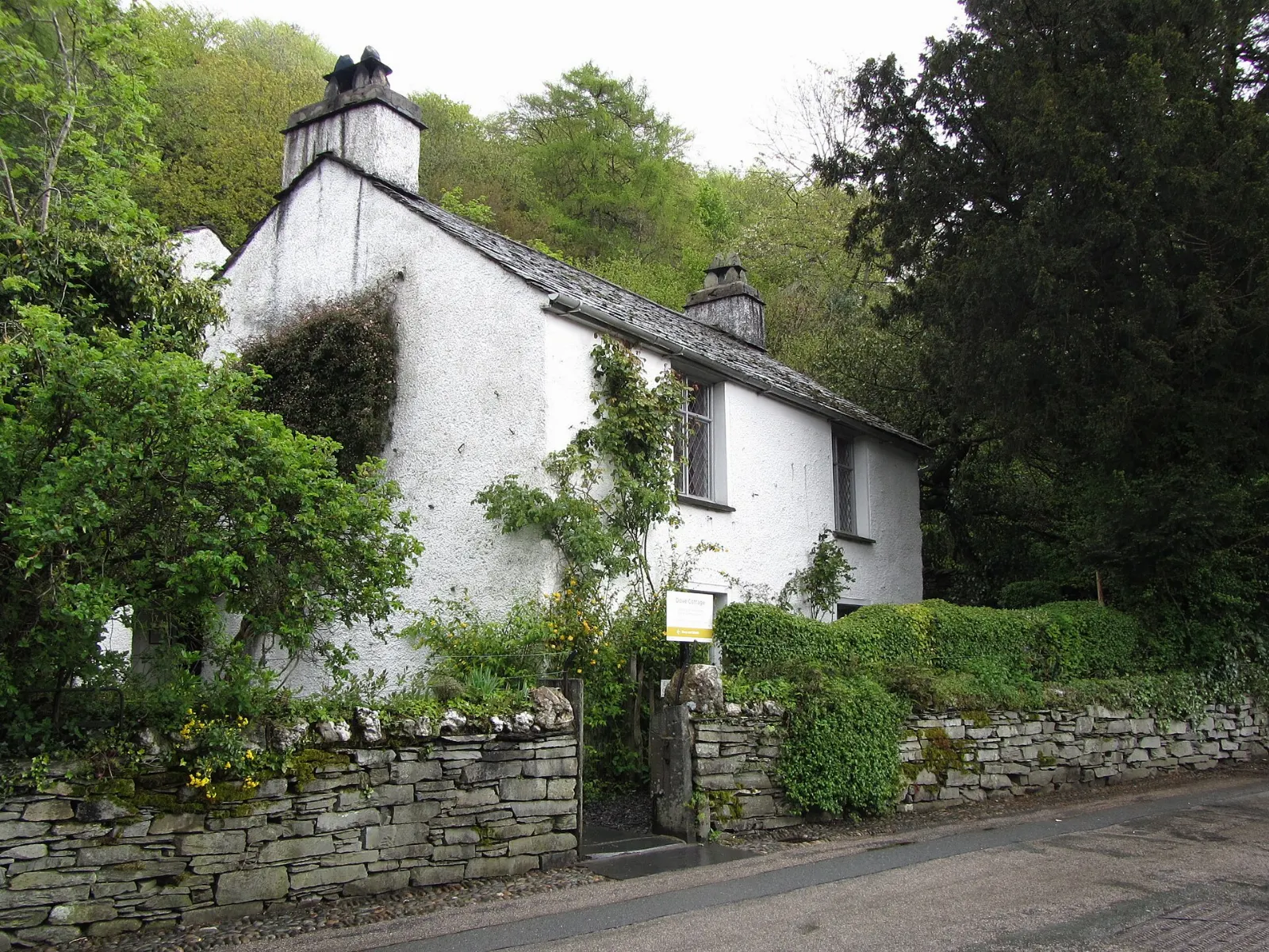 The small whitewashed stone cottage where William Wordsworth lived in Grasmere, Lake District, England