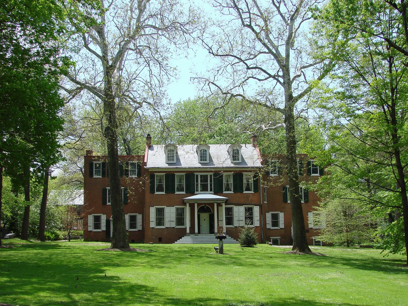 The brick Federal style mansion of Wheatland with white portico and lawn, Lancaster County, Pennsylvania