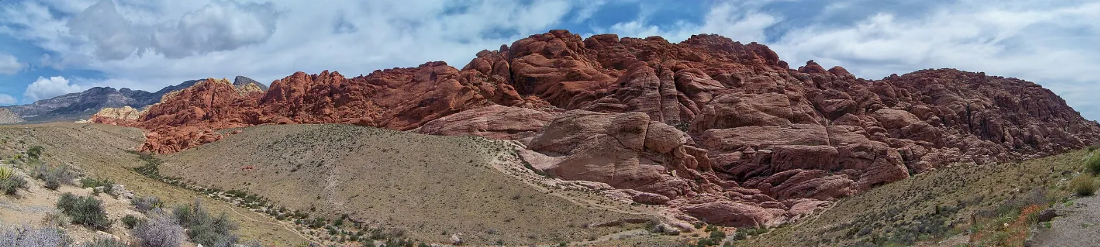 Swirling red and cream sandstone of the Calico Hills under a desert sky, Las Vegas, Nevada