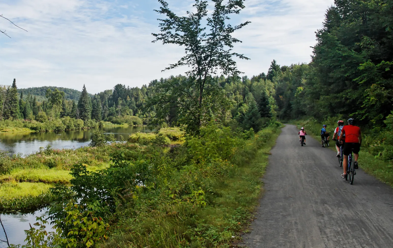 Cyclists on the Le P'tit Train du Nord rail trail, Laurentians, Quebec