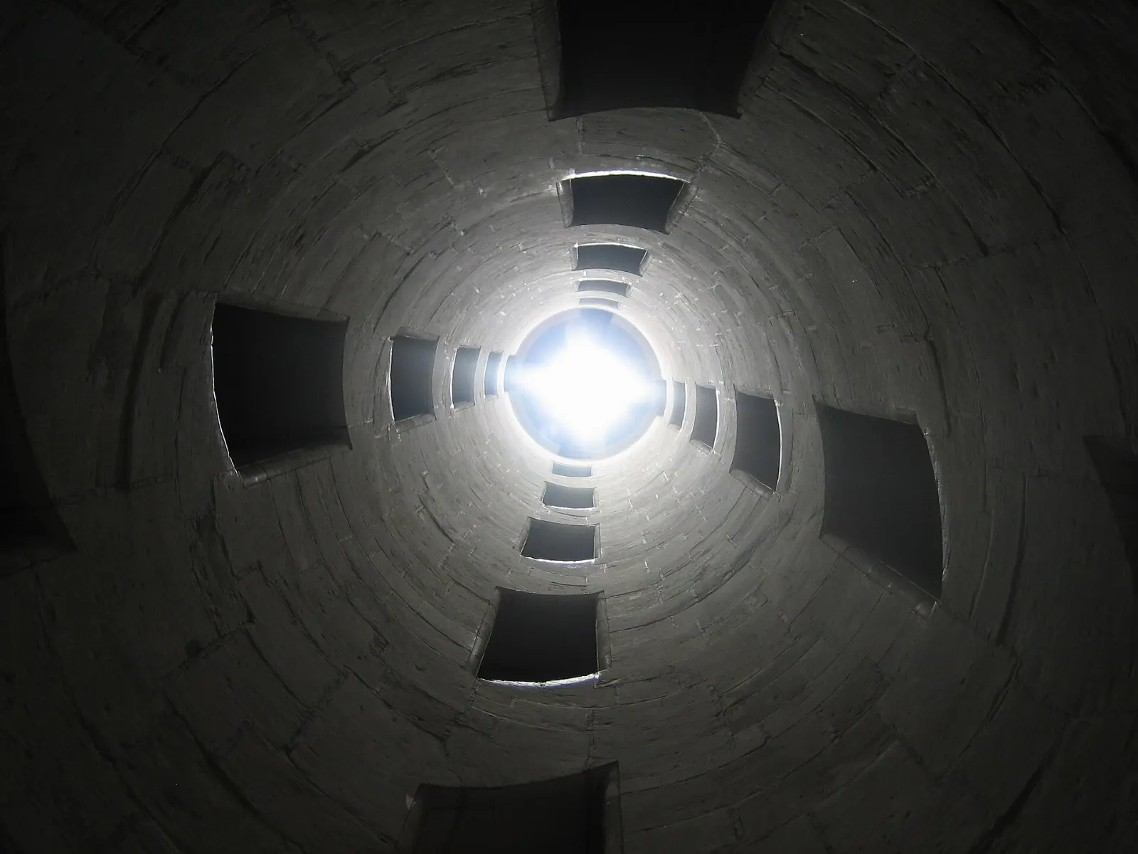 Looking up into the open double-spiral staircase at the center of Château de Chambord, Loire Valley, France
