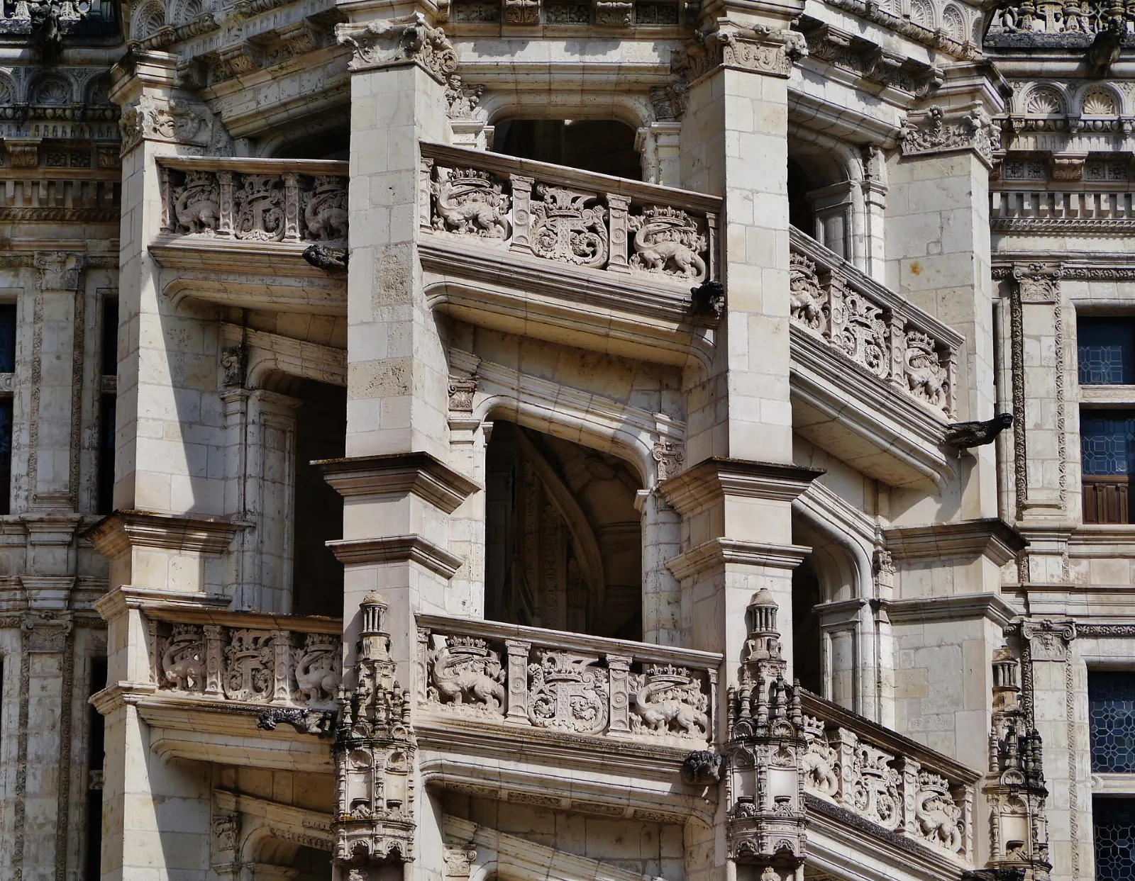 The ornate open spiral staircase on the Francis I wing of the Château de Blois courtyard, Loire Valley, France
