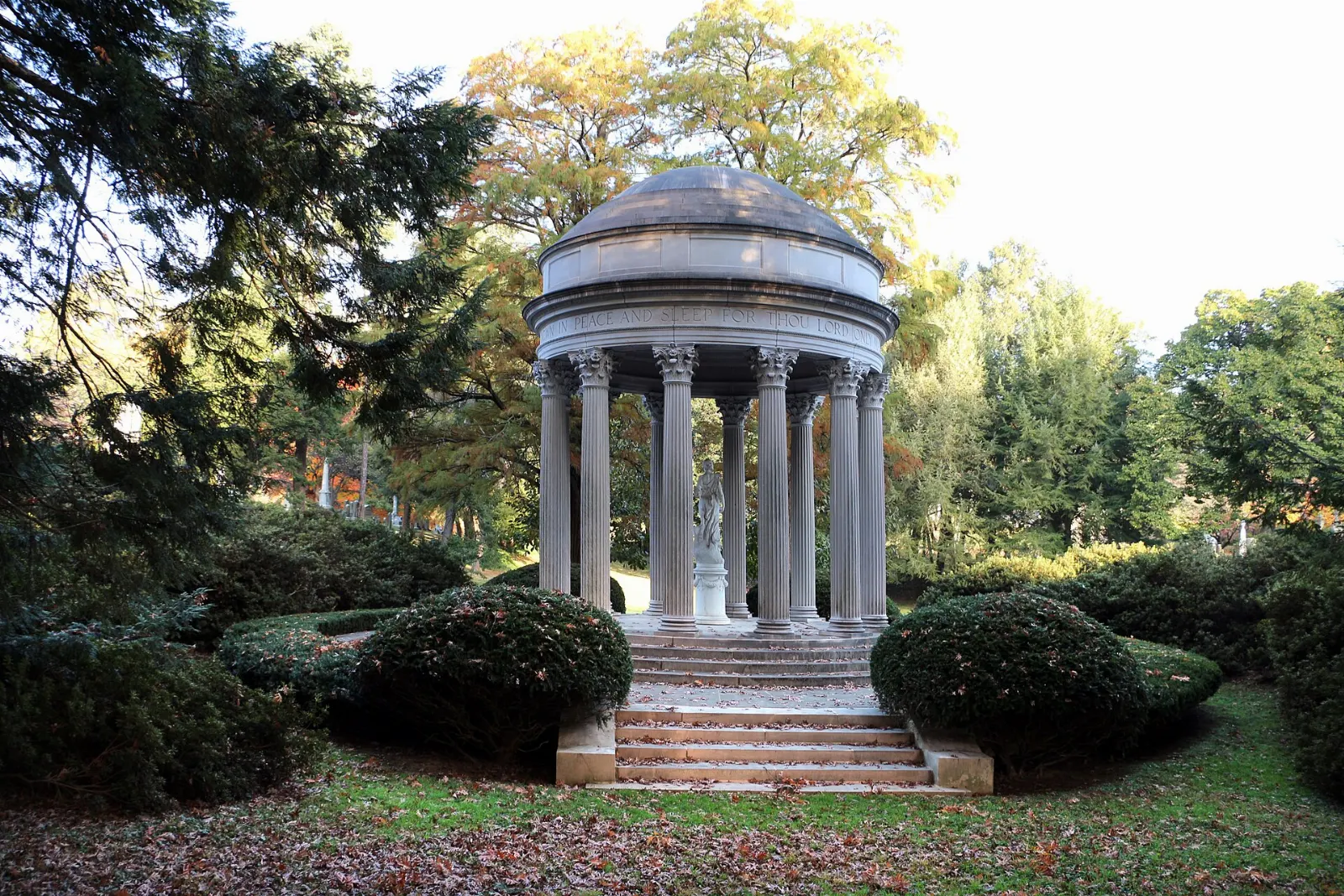 Tree-lined lanes and a lake inside Cave Hill Cemetery, Louisville, Kentucky