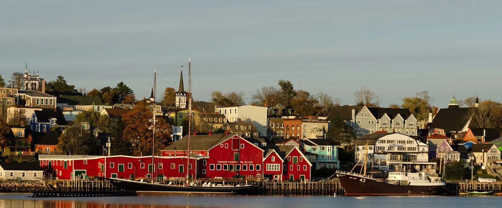 Red buildings and schooners at the Fisheries Museum of the Atlantic in Lunenburg, Nova Scotia