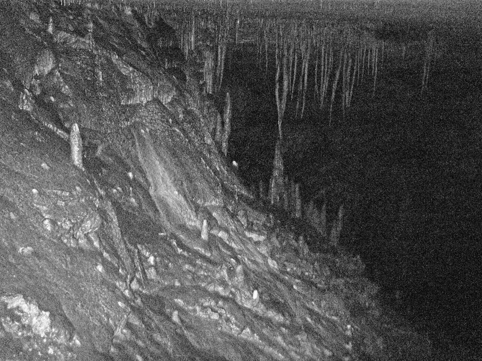 Stalactites and stalagmites lit along a walkway in Mammoth Cave, Mammoth Cave National Park, Kentucky
