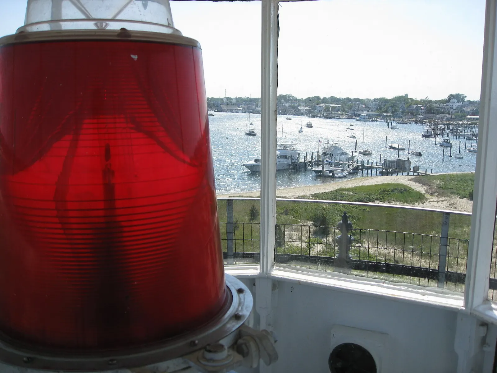 The white Edgartown Lighthouse at the end of a sandy path at the entrance to Edgartown Harbor, Martha's Vineyard, Massachusetts