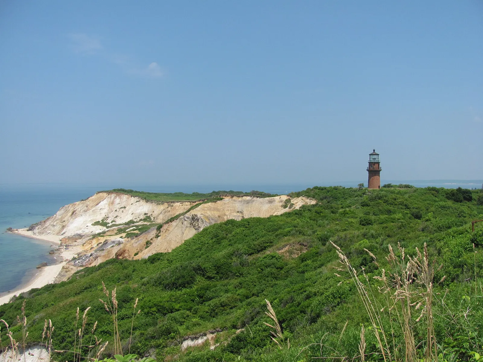 The red brick Gay Head Light on the grassy clifftop at Aquinnah, Martha's Vineyard, Massachusetts