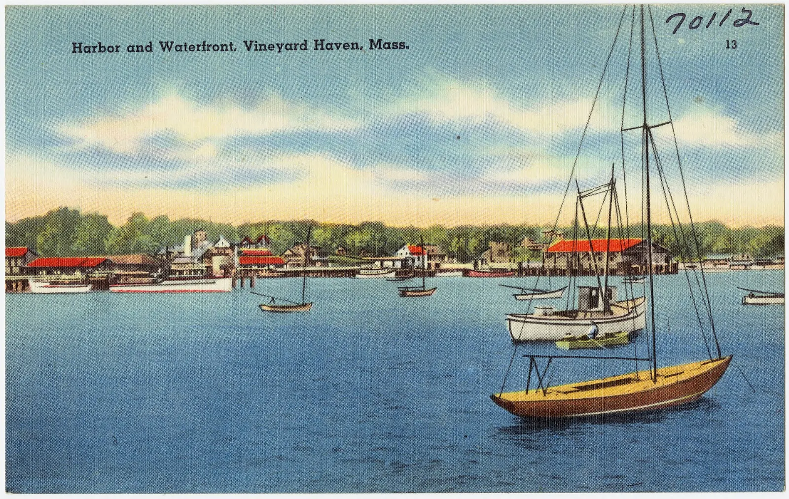 Sailboats moored in Vineyard Haven harbor with the town waterfront behind, Martha's Vineyard, Massachusetts