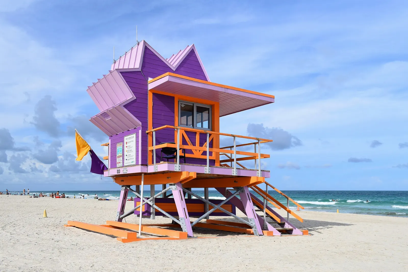 Colorful lifeguard tower on the wide sand of South Beach, Miami, Florida