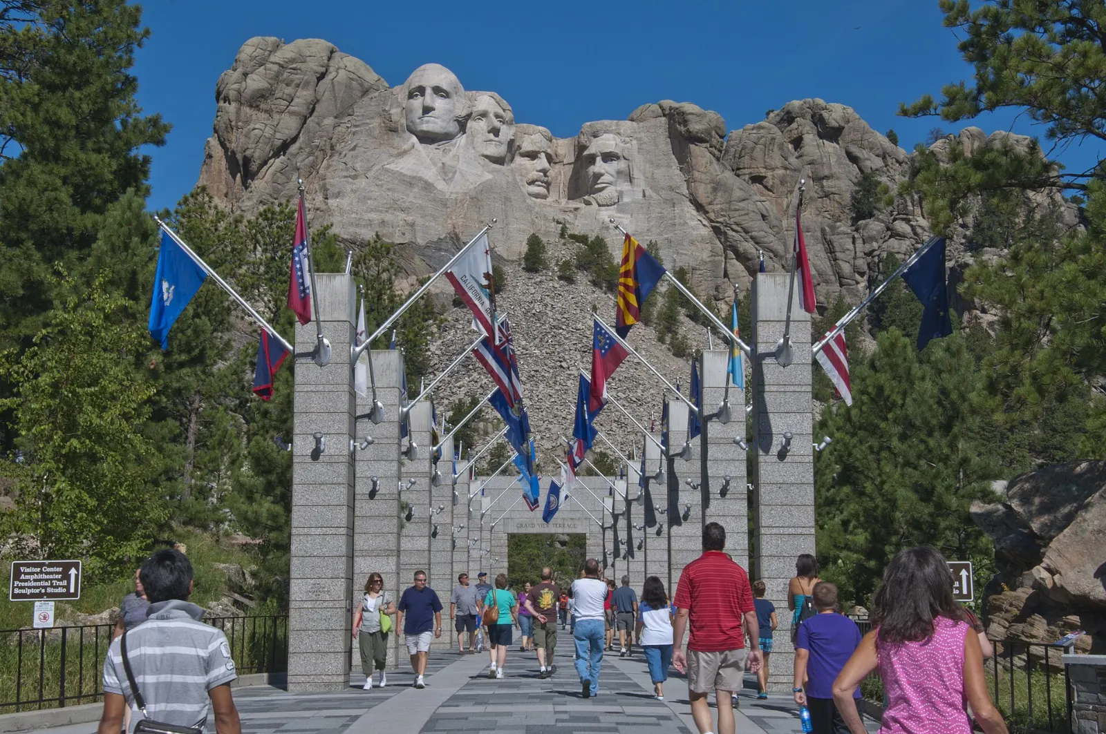 Rows of state flags lining the walkway toward the Mount Rushmore sculpture, Mount Rushmore and the Black Hills, South Dakota