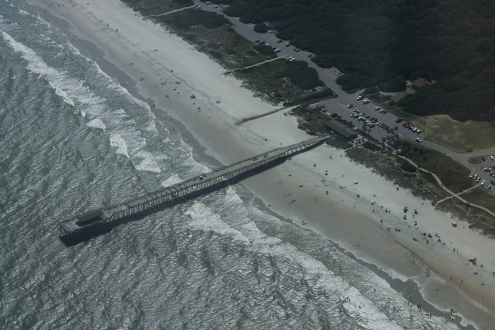 Fishing pier stretching into the Atlantic at Myrtle Beach State Park, South Carolina
