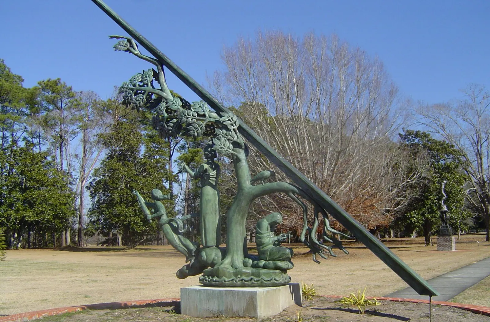 Bronze figurative sculpture framed by live oaks at Brookgreen Gardens, Myrtle Beach, South Carolina