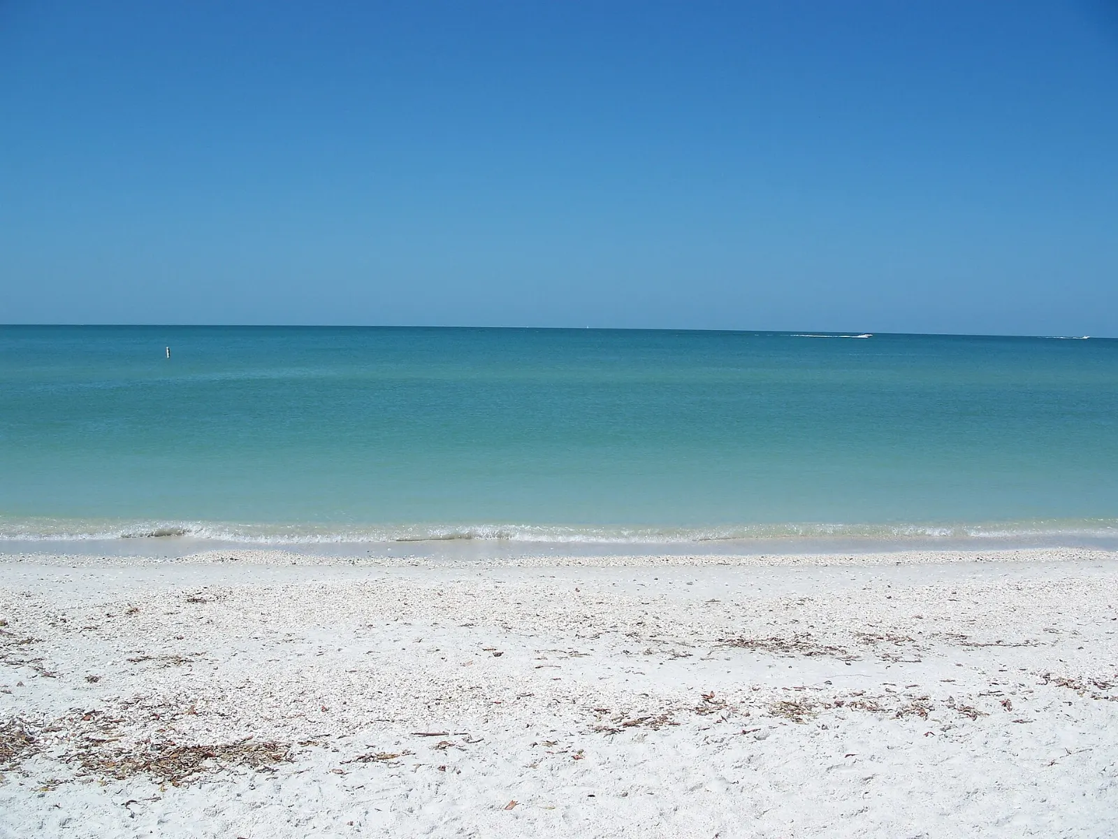 White sand beach and calm Gulf water at Delnor-Wiggins Pass State Park, Naples, Florida