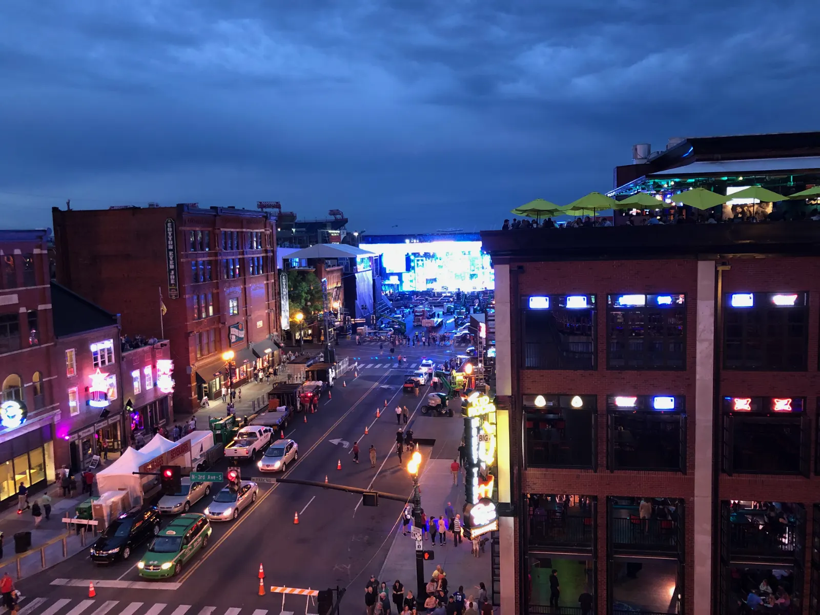Neon signs of honky-tonk bars lining Lower Broadway in Nashville at night, Tennessee