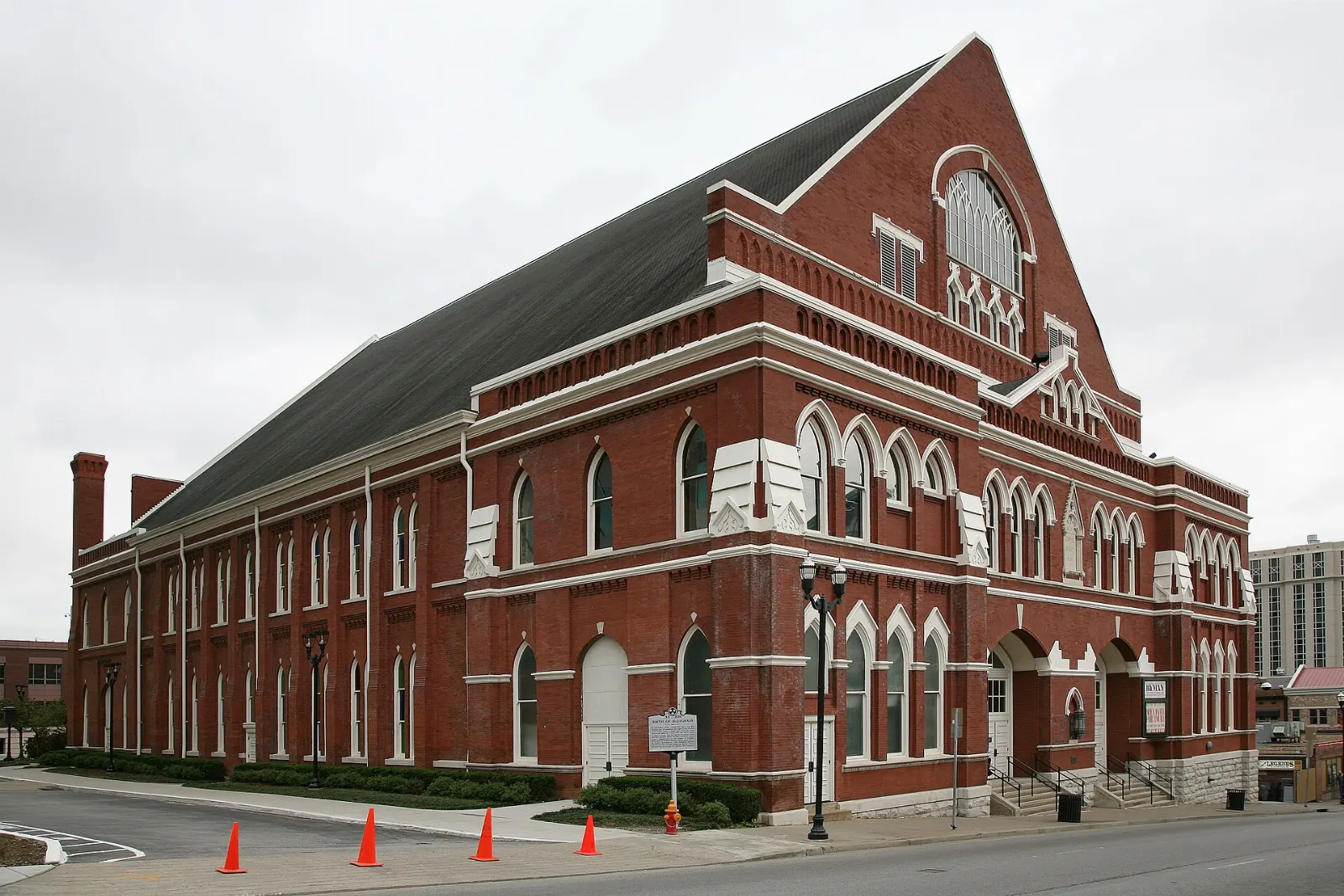 Red brick facade and arched stained glass windows of the Ryman Auditorium, Nashville, Tennessee
